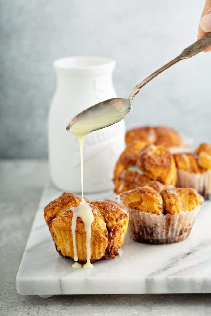 sweetened condensed milk drizzled over monkey muffins
