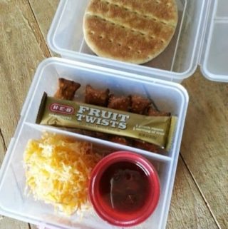 100 Days of Real Food - My kindergartner took her PlanetBox lunch box again  today. It works pretty well for this homemade pizza lunchable combo,  which includes: Plain whole-wheat pizza crusts, tomato