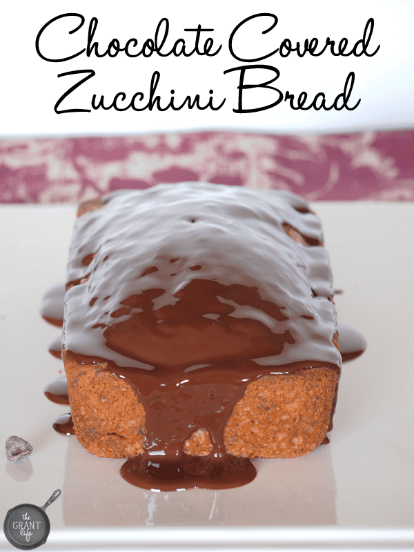 Chocolate covered zucchini bread! Delicious zucchini bread topped in rich chocolate ganache!