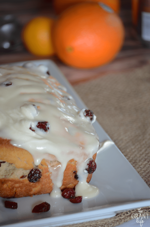 Cranberry orange beer bread covered in cream cheese frosting