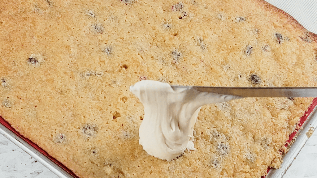 make the cream cheese frosting and spread it over the cooled bars