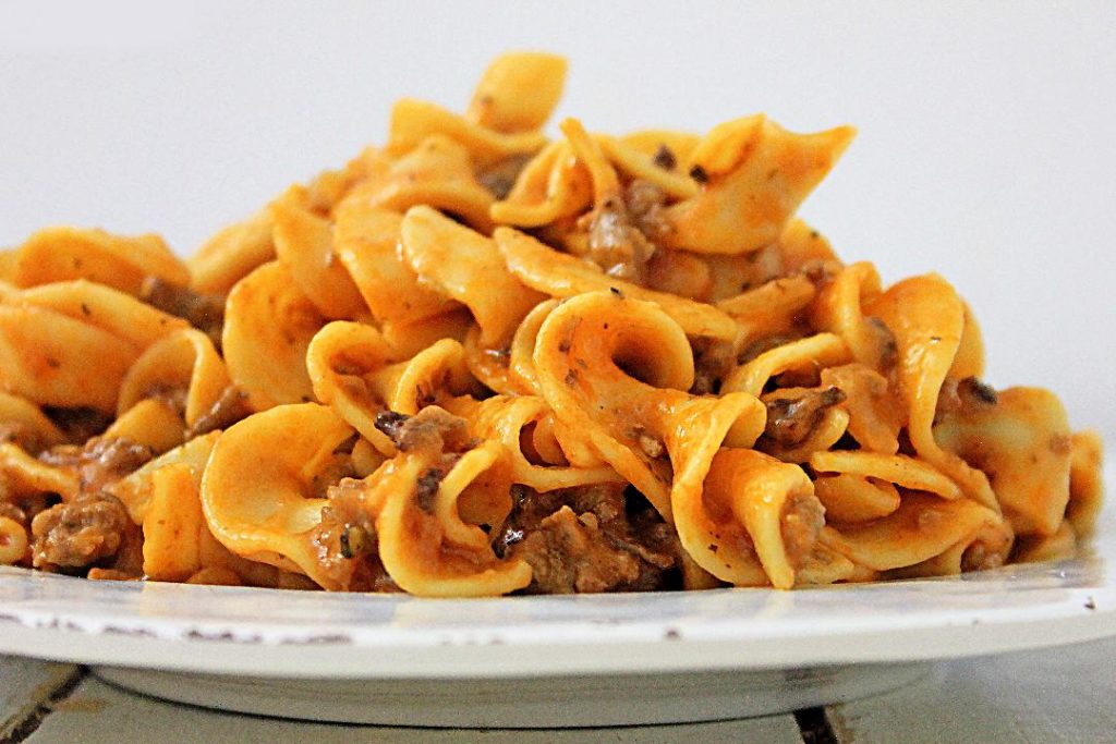 easy cheesy ground beef casserole on a white plate