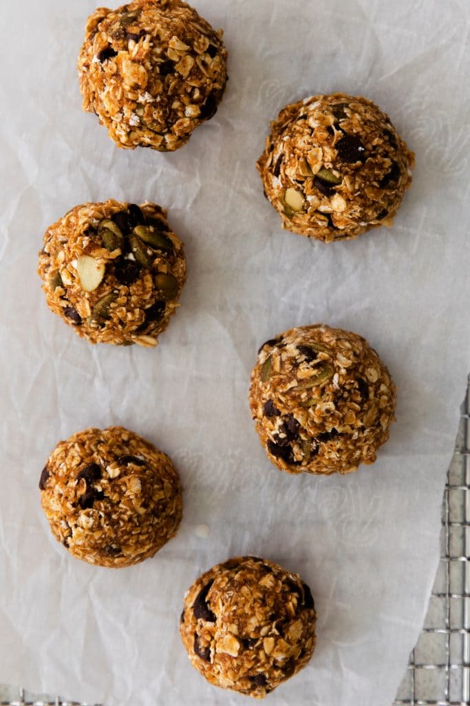 no bake lactation bites with pumpkin on parchment paper