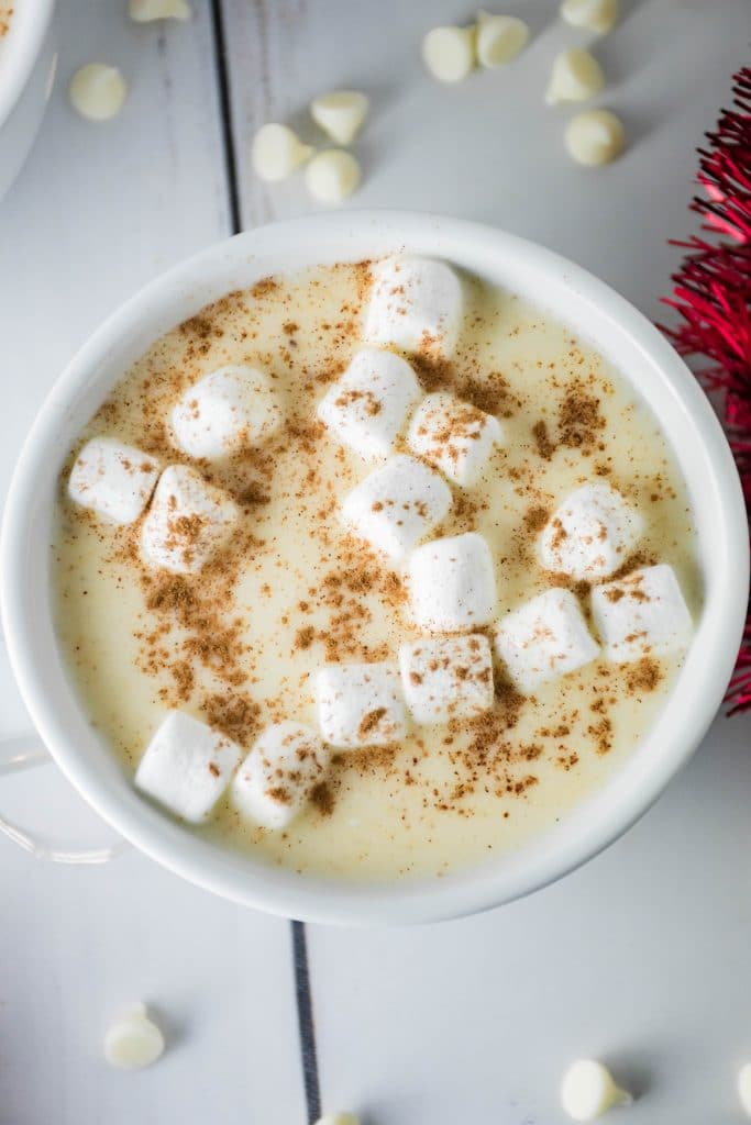 overhead shot of the white hot chocolate poured in a white mug