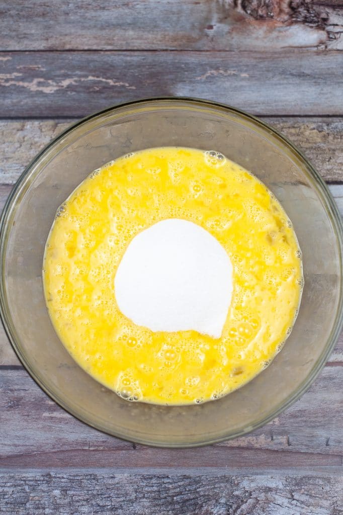 whisk eggs in a large mixing bowl 