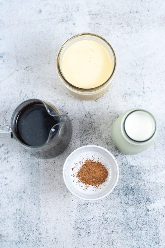 eggnog latte ignredients on concrete counter top