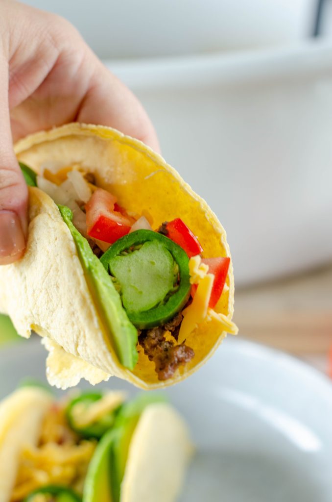 slow cooker taco in a corn tortilla