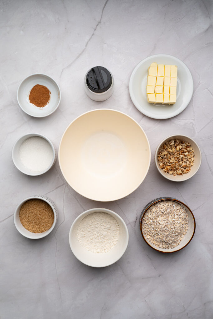 overhead shot of ingredients in bowls for apple crisp recipe