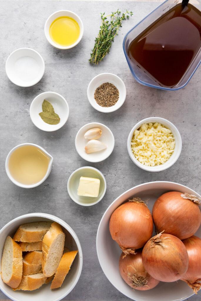 overhead shot of classic french onion ingredients on a concrete top