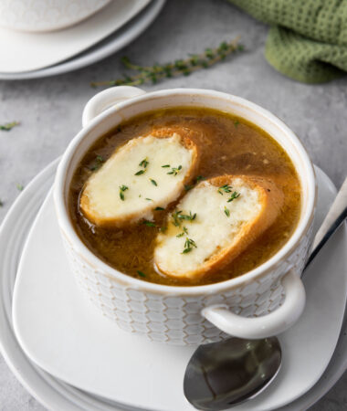 overhead shot of classic french onion soup on marble tabletop