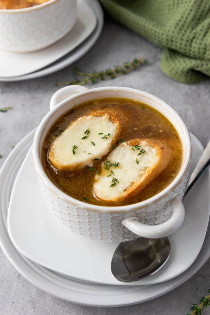 overhead shot of classic french onion soup on marble tabletop